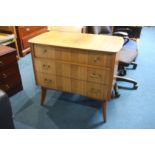 A walnut chest of drawers