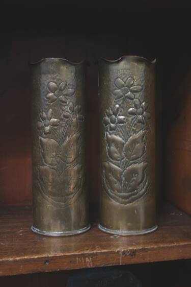 A pair of Trench art shell vases