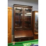 A reproduction mahogany bureau bookcase