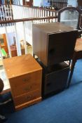A pair of bedside cabinets and a small chest of drawers