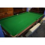 A half size snooker table with cues, balls and accessories