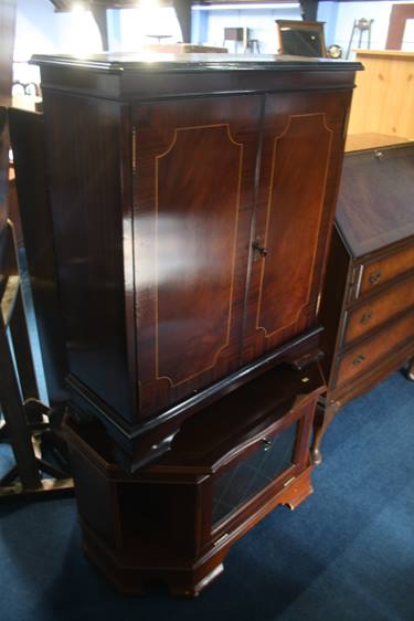 A mahogany TV cabinet and Hi Fi cabinet