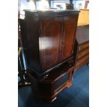 A mahogany TV cabinet and Hi Fi cabinet