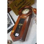 A mahogany cased wall clock