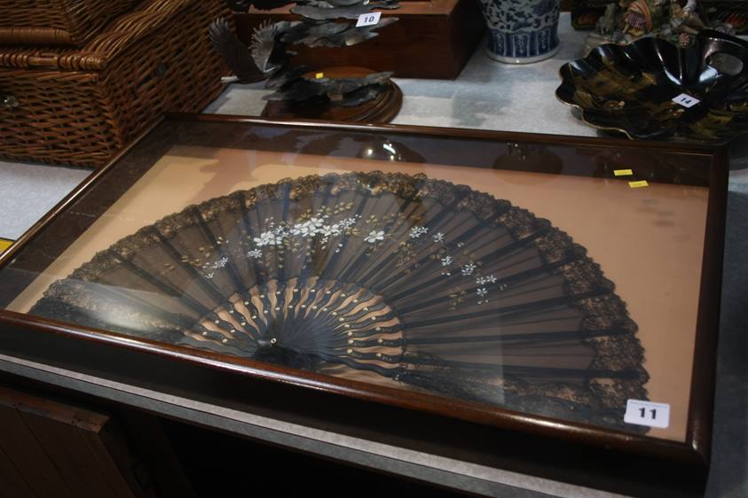 A mahogany cased lace fan
