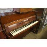 A mahogany upright piano