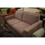 A beige two seater sofa