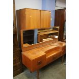 A teak two piece bedroom suite