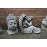 Garden figures; an angel and a Buddha's head