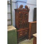 A reproduction mahogany display cabinet