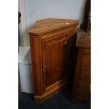 A pine corner cabinet