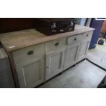 A large painted pine dresser base