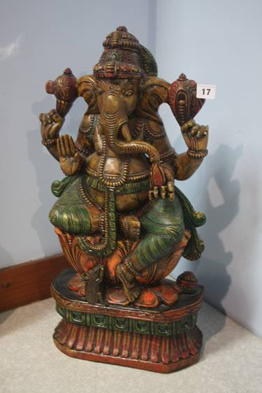 A heavily carved Indian Deity