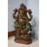 A heavily carved Indian Deity