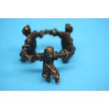 A bronze group of three boys hand in hand 6cm diameter and 4 cm height