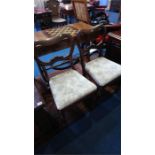 A set of four Victorian balloon back dining chairs