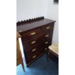 A straight front chest of drawers