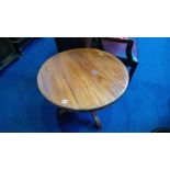 A reproduction mahogany circular table