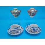 Two Oriental tea bowls and covers and two cups and saucers