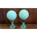 A pair of decorated pressed glass table lamps