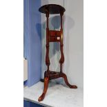 A reproduction mahogany stand