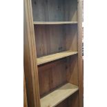 A tall pine open bookcase