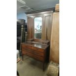 An Edwardian mahogany wardrobe and dressing chest