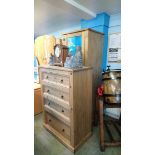 A narrow pine wardrobe and a pine chest of drawers