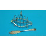 A silver toast rack and a butter knife