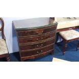 A walnut bow front chest of drawers