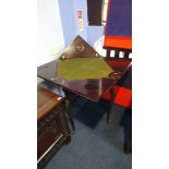 An Edwardian mahogany envelope card table