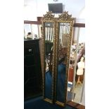 A pair of gilt edged narrow mirrors