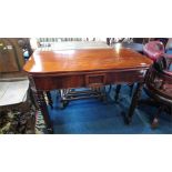 A Victorian mahogany fold over tea table