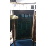 An oak hanging corner cabinet