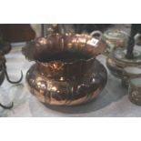 An Arts and Crafts copper jardinière