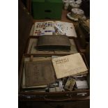 A collection of cigarette cards and stamps