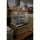 A bird cage, baskets and a TV