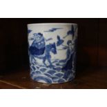 An Oriental blue and white brush pot