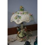 A Continental figural lamp and shade