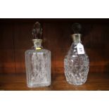 Two silver rimmed decanters