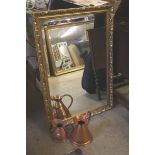 A gilt mirror, two copper jugs,a very large print of roses and a small wooden stand