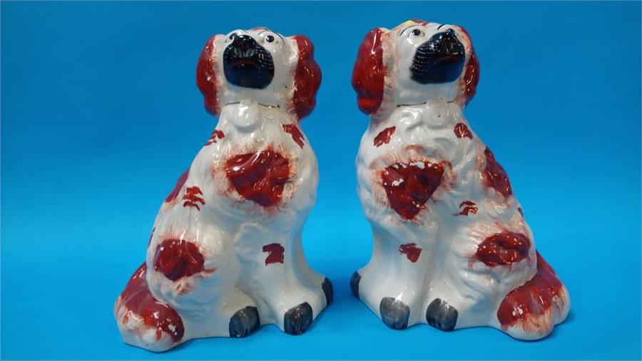 A pair of Staffordshire pot dogs