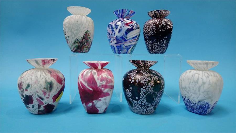 A collection of seven studio glass bud vases