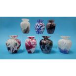 A collection of seven studio glass bud vases