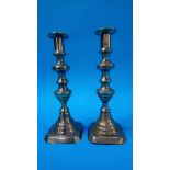 A pair of brass ejector candlesticks