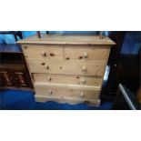 A pine chest of drawers