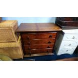 An oak chest of drawers