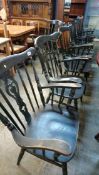 Seven spindle back carver chairs