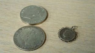 A sixpence in a silver mount, World War II medal etc.
