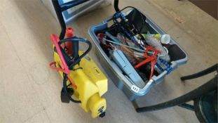 A jump starter and various tools